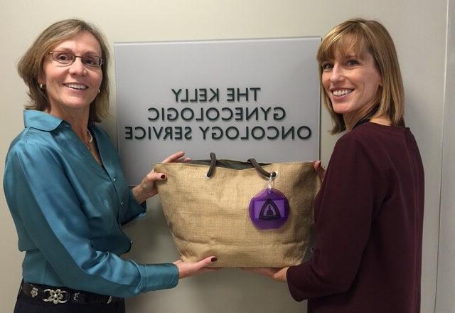 Susan Burgert and Pamela holding a care bag